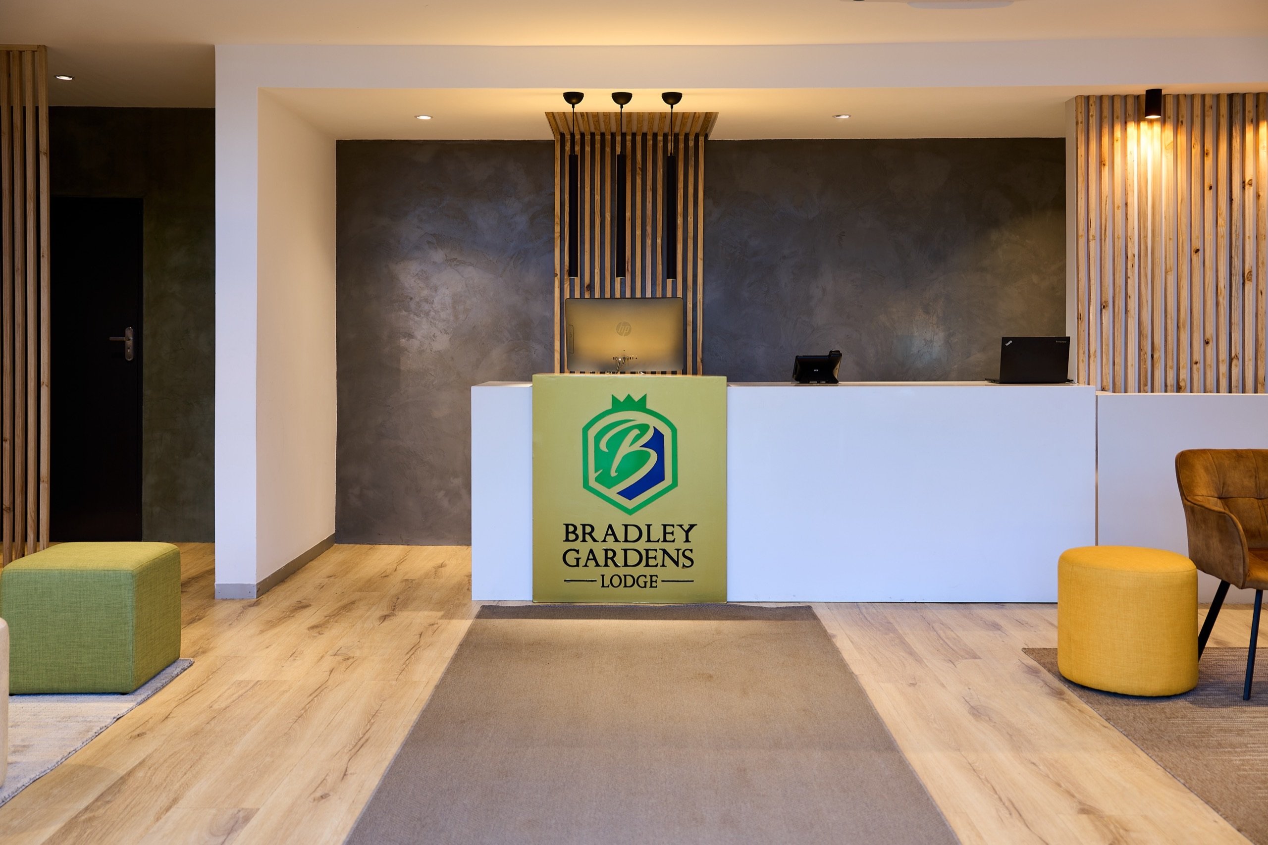 Reception desk with Bradley Gardens Lodge signage